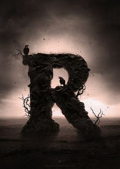 the letter r is made up of branches with birds perched on it and dark clouds in the background