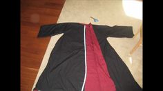 a black and red coat laying on the floor