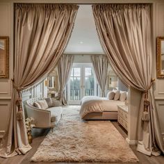 an elegant bedroom with beige curtains and white bedding, along with a large rug on the floor