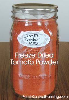 a glass jar filled with freeze dried tomato powder