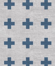 a blue and white rug with crosses on it