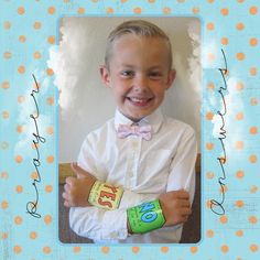 a young boy in a white shirt and bow tie with his hands on his chest