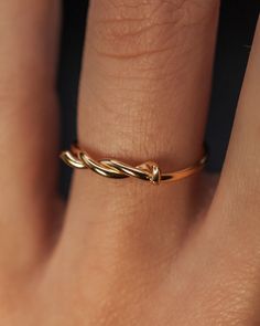 A thick, sleek and durable barbwire inspired ring. Add a unique twist to your stack! This listing is for ONE SINGLE Barbed Wire Ring in 14K GOLD FILL. To create the Barbed Wire Ring, we wrap metal wire in to a twisted shape. This ring is a great alternative to a simple band and pairs perfectly with other stacking rings. These make perfect bridesmaid or friendship rings! Every piece is organic and unique — no two Hannah Naomi pieces are exactly alike.Hand-crafted to order in our Portland, OR stud Simple Rings Everyday Casual Wire, Yellow Gold Wire Wrapped Promise Ring, 14k Gold Twisted Promise Ring, Gold Minimalist Wire Wrapped Stackable Rings, Delicate Gold Wire Wrapped Rings, 14k Gold Twisted Rings For Gift, Gold Open Ring With Wire Wrapped Detail, Wire Wrapped 14k Gold Rings, Minimalist 14k Gold Wire Wrapped Rings