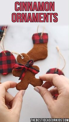 someone is holding up a homemade christmas ornament to make it look like a gingerbread man