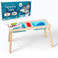 a wooden table with two trays on it and an empty box in the background