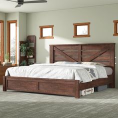 a bedroom with a bed, dresser and two windows in the room that has carpeted flooring