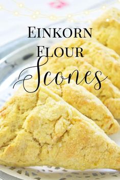 three scones sitting on top of a plate with the words, enikorn flour stones