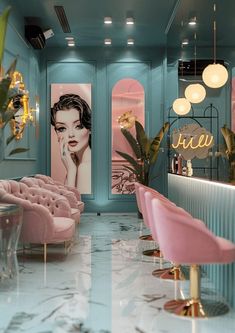 the interior of a salon with pink and blue chairs, gold chandeliers and paintings on the walls