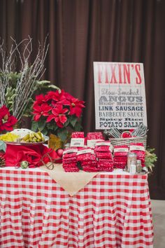 red and white checkered table cloth with poinsettis