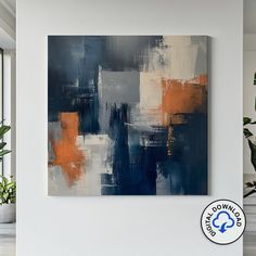 an abstract painting in blue, orange and white on a wall next to a potted plant