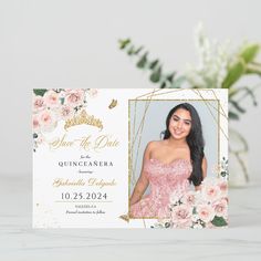 an elegant photo save the date card with pink flowers and greenery on it in front of a white background