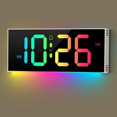 the digital clock is displaying the time in different colors and shapes, including red, yellow, green, blue, orange