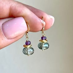 Green Topaz and Amethyst Earrings, Tiny Teal and Purple Earrings, Minimalist Gold or Silver Dangle Drops, Small Delicate, Gift for women These petite earrings feature teal Green Topaz rondelle gemstones (8 mm) topped by a gold filled or silver spacer and an Amethyst rondelle (3mm), all wire wrapped and suspended from french ear wires in the finish of your choice.   Perfectly simple, understated, small every day earrings. Photos are maximized to show detail. These are tiny earrings. Please refer Sea Earrings, Green Topaz, Petite Earrings, Amethyst Birthstone, Silver Gift Wrap, Dragonfly Earrings, Purple Earrings, Tiny Earrings, Etsy Favorites