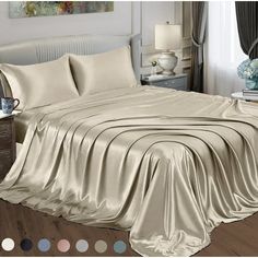 an image of a bedroom setting with sheets and pillows on the bedspread in neutral colors