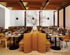 a restaurant with wooden tables and yellow chairs