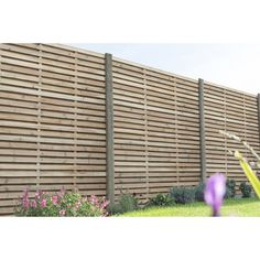 an image of a wooden fence in the yard