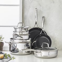 pots and pans are stacked on the counter