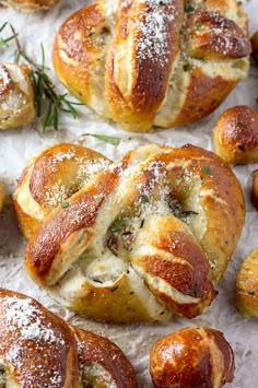 several different views of baked breads with cheese and herbs