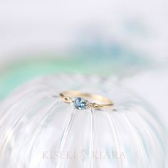 a close up of a ring on top of a cake