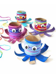 these paper cups are made to look like octopuses with googly eyes and ribbons