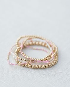 - 2mm gold filled ball beads mixed with color glass seed beads - 6.5 inches Gold And Pink Bracelet Stack, Hazel Boutique Bracelets, Gold And Pink Bracelet, Pink And Gold Bracelet, Trendy Bracelets 2024, Bracelet Ideas Seed Beads, Gold And Pink Jewelry, Bracelet Stack Ideas, Jewelry Accessories Bracelets