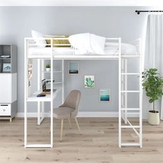 a white loft bed sitting on top of a hard wood floor next to a desk