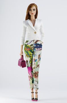 a barbie doll is holding a purse and standing in front of a white background with flowers on it