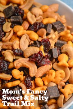 a bowl full of nuts and raisins with the words mom's fancy sweet & salty trail mix