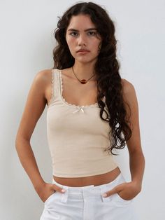 Experience the ultimate in sexy style with this slim-fit tank top made from comfortable jersey fabric. Featuring a solid pattern with lace, tulle, and fishnet elements, this crop top is versatile enough to pair with any bottom. The crew neckline adds a touch of sophistication, making it the perfect addition to your summer wardrobe. Made from high-quality polyester, it's the ultimate must-have for the season. Lace Camisole Top, Lace Trim Tank Top, Solid Tank Tops, Summer Streetwear, Club Night, Lace Camisole, Sleeveless Crop Top, Solid Clothes, Neck Lace