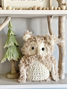 a stuffed animal sitting on top of a shelf