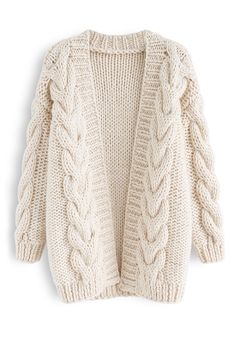 a white sweater with cable knits on the shoulders