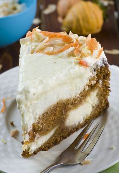 a piece of carrot cake on a plate with a fork