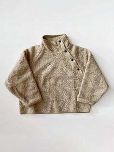 Relaxed, simple, and made with our ethically sourced organic sherpa, The Sherpa Sweater features a high neck with adjustable, brushed-brass snaps to keep your little ones warm and cozy. It’s lined with luxuriously soft, organic cotton jersey for ultimate comfort and carefree play all winter. Layers like a dream with Th Blush Tie, Winter Layers, Everyday Leggings, Tie Dye Leggings, Knitted Romper