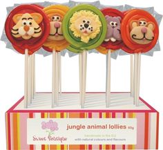 there are four lollipops with animals on them in the shape of lions