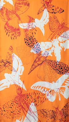 an orange and white butterfly print fabric