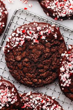 chocolate peppermint cookies on a cooling rack with sprinkles