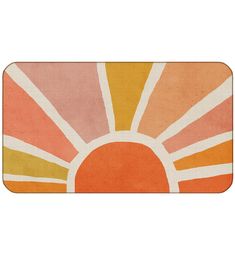 an orange, yellow and pink rug with the sun on it