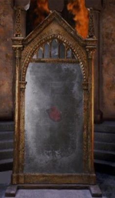 an ornate gold framed mirror in the middle of a room filled with stairs and steps