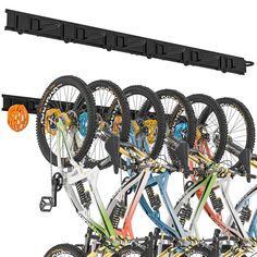 several bikes are hanging on the rack in front of each other with wheels attached to it