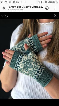 a woman wearing green knitted mittens and holding her hands in front of her