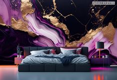 a bed sitting under a purple and gold wall mural