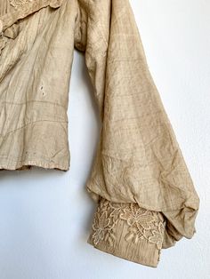 The most glorious antique ecru silk blouse. High neck, puff shoulder, lace at cuffs and chest, delicate pin tucks at front and back. So many good details and such structure. Fabric: Silk & laceFit: XS Measurements: Bust 30” Shoulders 12.5” Sleeve 20”Waist 24” Arm opening (flat) 7” Neck 12.5” Condition: Good. As found antique. Blouse High Neck, Silk Lace, Fabric Silk, Pin Tucks, Lace Blouse, Silk Blouse, Bell Sleeve Top, High Neck, Silk