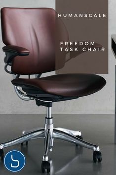 a brown leather office chair sitting on top of a metal desk