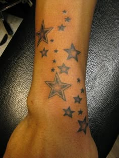 a person with a star tattoo on their arm