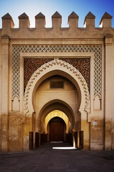 the entrance to an old building with arched doorways