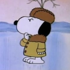 a cartoon character with a hat and coat on standing in front of a snow covered ground