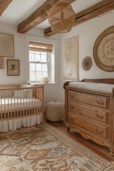 a baby's room with a crib, dresser and window