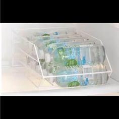 a refrigerator filled with lots of bottled water