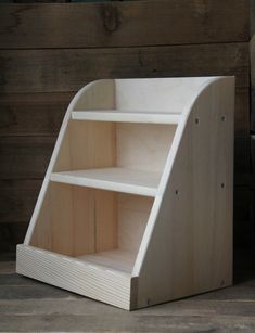 a wooden shelf sitting on top of a hard wood floor