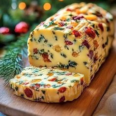 sliced cheese on a cutting board with christmas decorations in the background